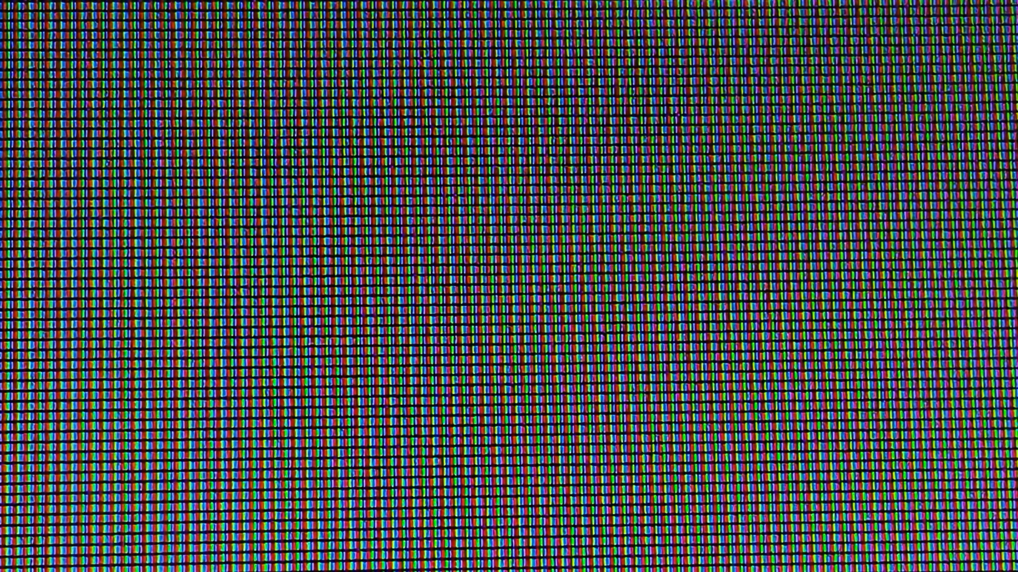 Close-up of red, green, and blue pixels on a digital display.