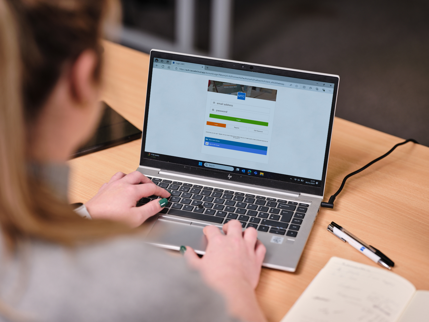 User completes a login form on a laptop during a practical form usability review.