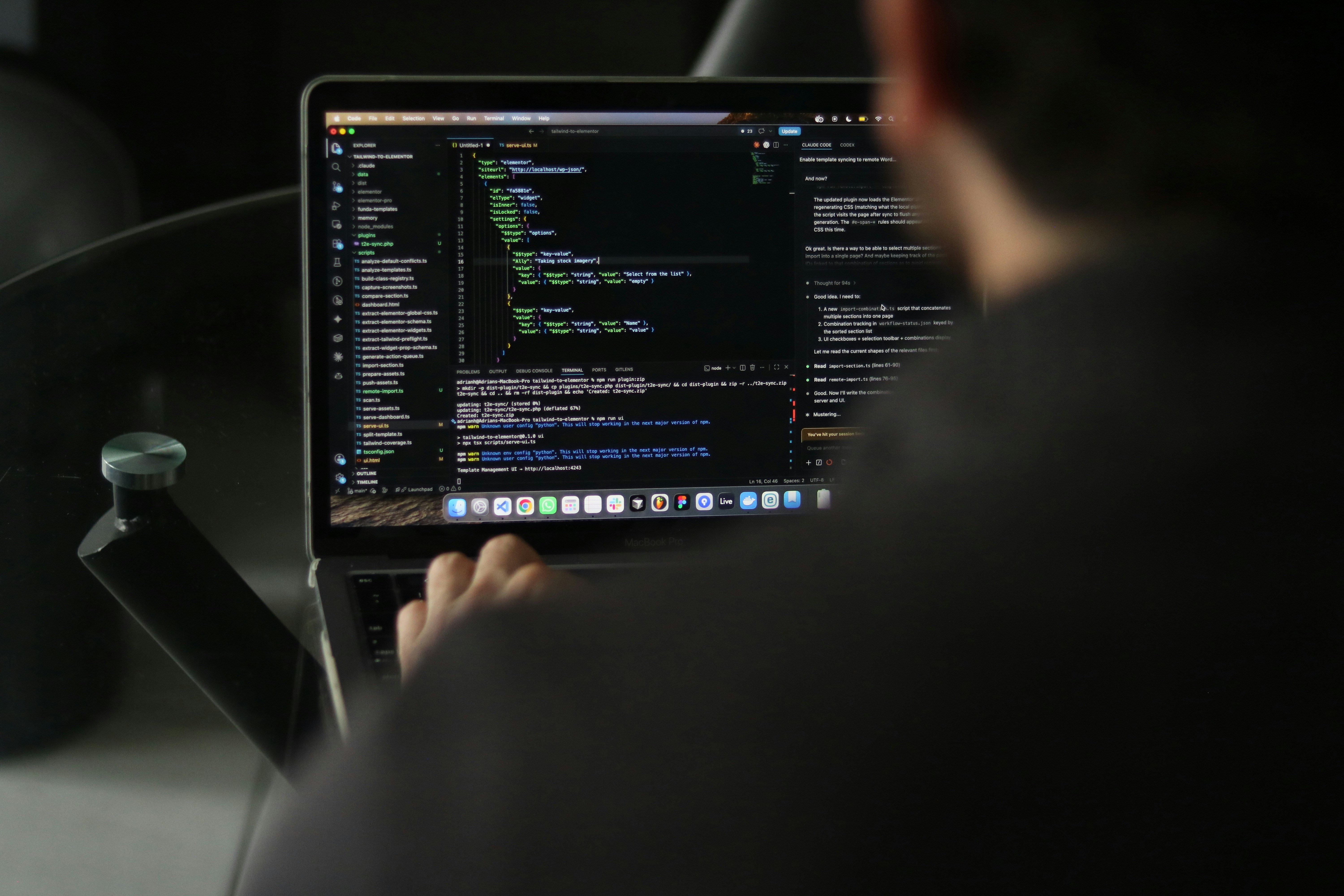 Developer reviewing web code on a laptop while evaluating website accessibility implementation and semantic HTML.